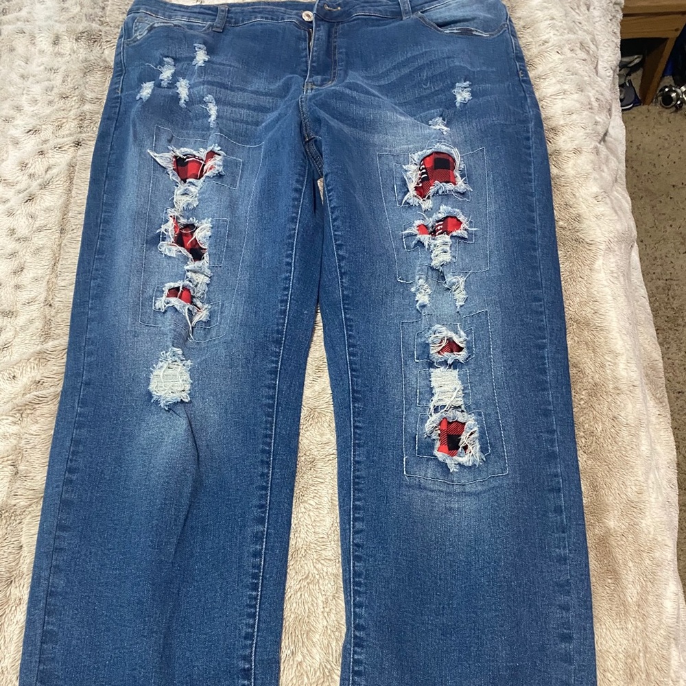 Women’s jeans with red plaid patches